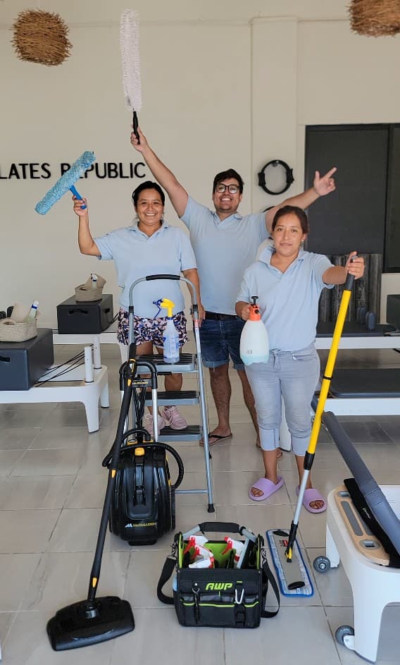 Qtana Cleaning team members with professional cleaning equipment